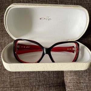 Red and black Oakley Betray sunglass fames and original case
